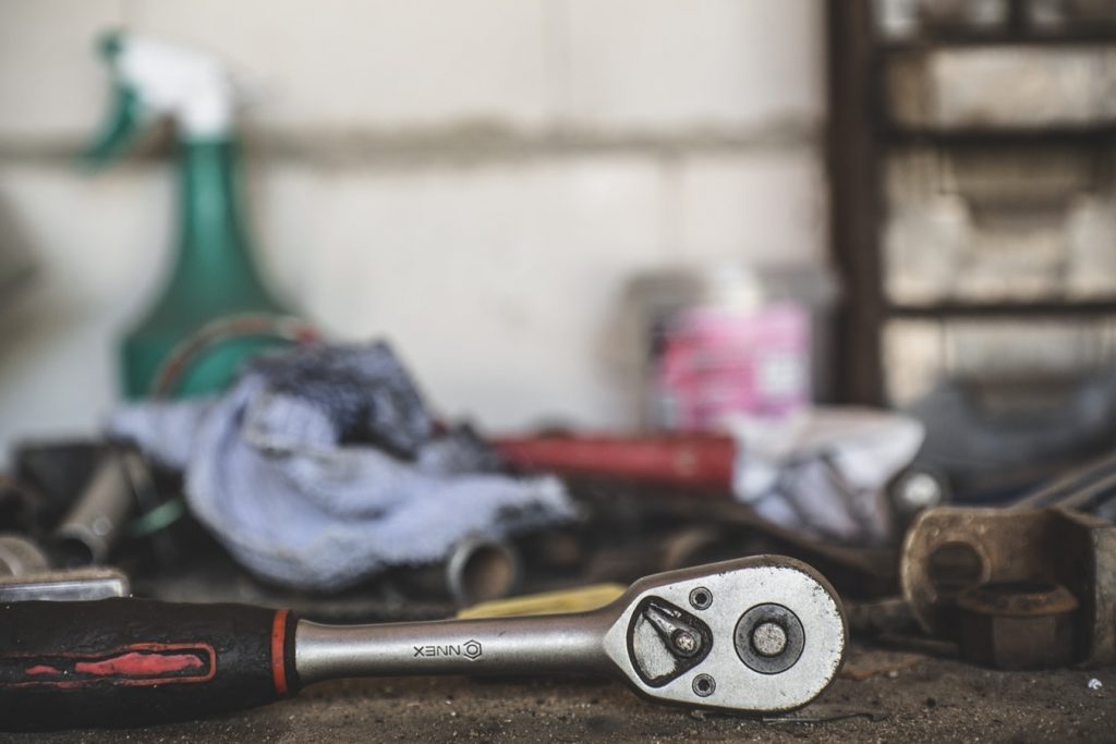 dirty tools in a car garage